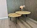 Nordstahl Pin poten onder ronde tafels in modern interieur